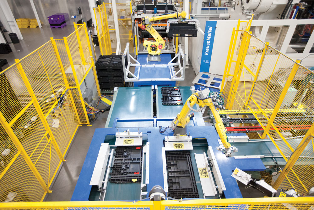 A factory interior showcasing robots and machines, highlighting the Monoflo Mexico expansion project.